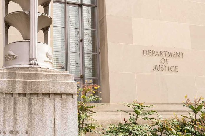 shutterstock_2271133921 Department of Justice building facade with stone sign and window
