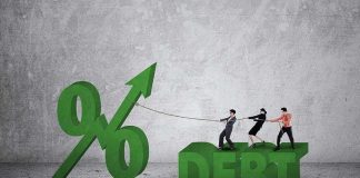 Three people pulling rope tied to rising percent sign beside large debt text