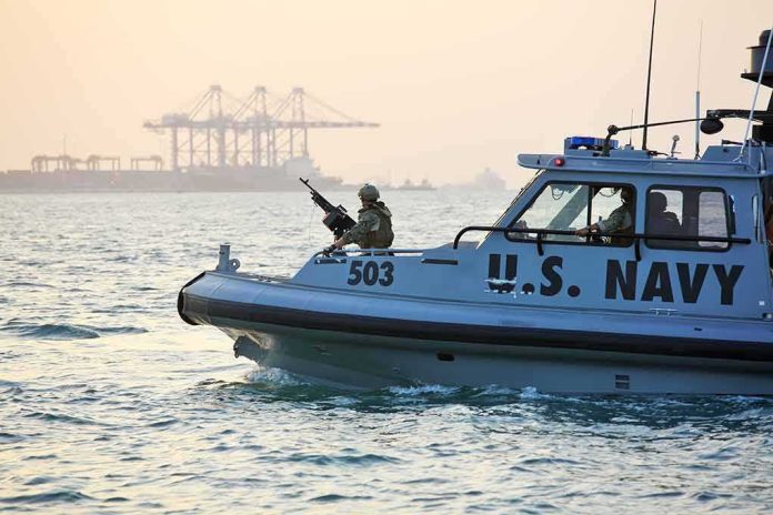 U.S. Navy patrol boat with armed crew on the water