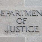 Department of Justice inscription on stone wall