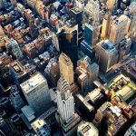 Aerial view of dense downtown skyscrapers at sunset