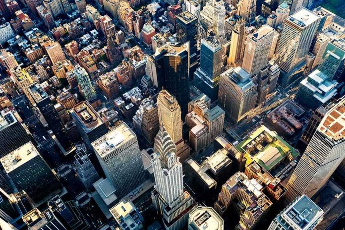 Aerial view of dense downtown skyscrapers at sunset