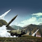 mobile missile launcher firing in mountain landscape