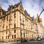 Historic stone apartment building on a busy city corner