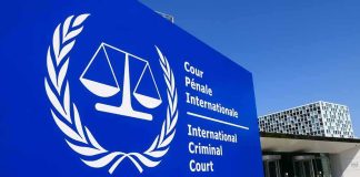 U.S. Slaps ICC – Judges Hit With Sanctions International Criminal Court sign with scales emblem outside modern building