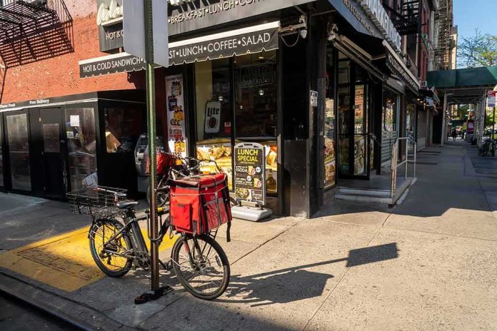 Delivery bicycle parked outside a corner deli
