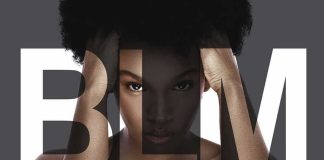 Woman with afro framed by large letters