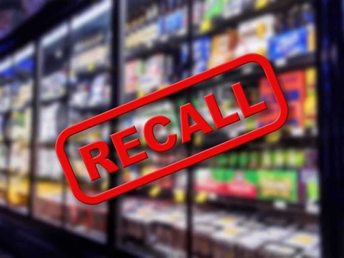 Recall sign over supermarket freezer aisle