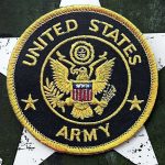 United States Army embroidered patch on a green star background