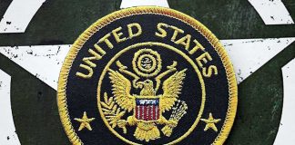 United States Army embroidered patch on a green star background