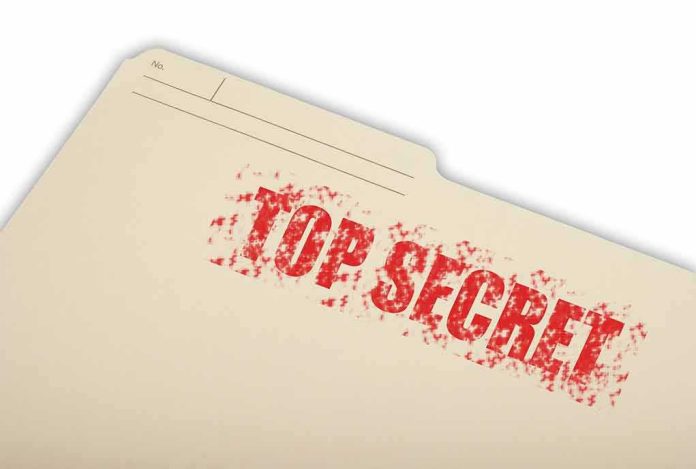 Manila file folder stamped TOP SECRET in red