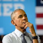Old Obama Criticism Resurfaces Before Rally man in dress shirt and tie thinking on stage