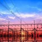 Electrical substation with power lines at sunset