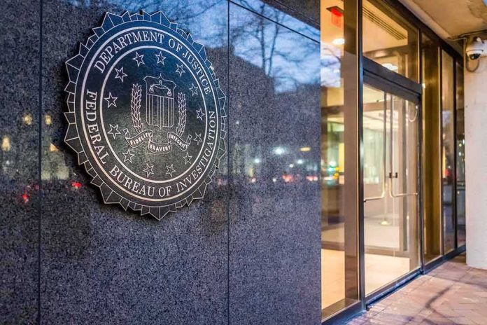 shutterstock_555190222 FBI emblem on a stone wall beside a glass entrance